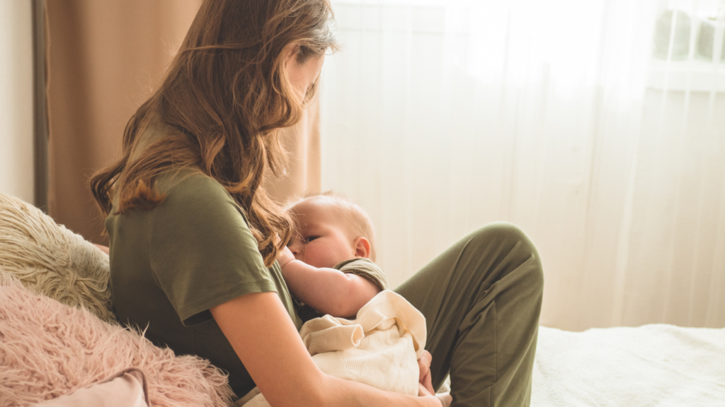 Mum nursing a baby on a bed