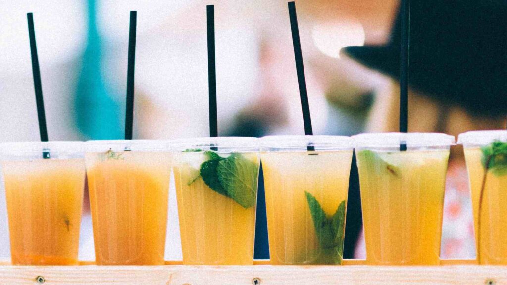 Line of mimosas or orange juice. Photo by Roman Kraft from Unsplash