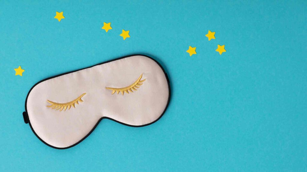 Face mask on blue background with stars