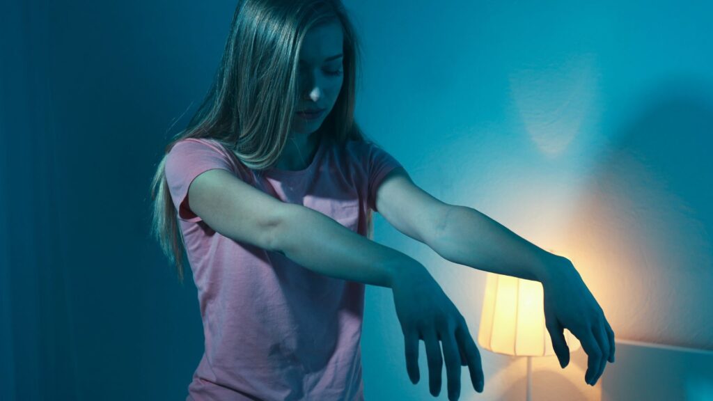 A person sleep walking (suffering from a parasomnia)